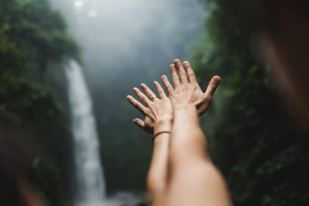 hands outstretched in the Waterfalls